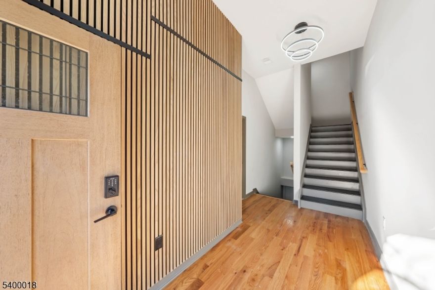 Step into this sleek and modern 2-bedroom, 3-bathroom home spanning three levels of living, giving it the feel of a townhouse. High ceilings and sun-drenched rooms with abundant windows create an open, airy atmosphere. The contemporary chef's kitchen features quartz countertops, GE stainless steel appliances, stylish pendant lighting, and ample cabinet space. Enjoy the convenience of an in-unit washer and dryer for effortless everyday living.The bathrooms impress with marble-style tile, dark gray flooring, and chic black hardware, adding a touch of luxury. Step outside to the rooftop terrace to unwind or entertain while taking in rare NYC skyline views a true standout in this area!Perfectly situated just steps from Ferry Street's restaurants, caf s, shops, parks, and major transit options, this home combines style, convenience, and modern comfort. Resident parking is available, making life even easier. A must-see for anyone seeking contemporary living in a prime Newark location!