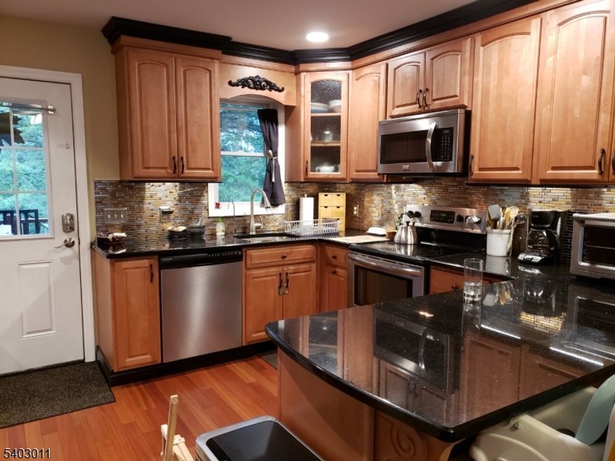 SEPARATE ENTRANCE, FENCED IN GARDEN IN LARGE YARD!  FANTASTIC 2nd Floor Apartment! 1 BEDROOM PLUS 1 SMALL ROOM/OFFICE, Updated Kitchen, Living Room, Bathroom, Deck (entrance) and YARD USE!  Tenant pays utilities.  Fiber Optic available!  Hardwood Floors, Kitchen with Stainless Steel Appliances and granite countertop/breakfast bar!  Walk in Closet in Bedroom plus additional 2nd very small room can be used as office/ den etc. Shared laundry in garage below this unit. Property in Riverdale with mailing address (and GPS) in Pompton Plains. Shared use of large yard! Fenced in Garden to grown veggies/plants/flowers! 1 PET MAY BE CONSIDERED