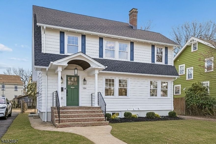 Step into this stunning, sun-soaked expanded colonial, with exquisite craftsmanship by Lefko Brothers and located in the Village Colonials neighborhood of South Orange. The charming entry vestibule leads to a foyer with coat closet and an inviting living room with WBF. A light-filled, multi-purpose room makes an ideal study/den or playroom. The oh-so-stylish kitchen with new appliances, sleek cabinets, contemporary lighting, solid surface countertops, stunning tile backsplash and center island with seating is an ideal gathering space and extends into the bright dining room. A clutter control mud room easily organizes everyone, with a generous-sized powder room just steps away. Walk up to three bedrooms, two full baths and linen closet on the second level. Hardwood floors throughout. The spacious primary suite offers both privacy and luxury with a walk-in closet, and sumptuous full bath with oversized shower and double vanities. A second ensuite, perfect for guests, is located on the third level. The lower level has been thoughtfully designed with a wine fridge and cabinets, family and rec rooms, full bath, laundry, storage and utilities. Outside, the deep, level backyard with new patio and one-car garage is the perfect space to entertain and play year around. With an easy stroll to downtown South Orange, home to SOPAC, eclectic dining options and NYC transit, this home offers the perfect blend of move-in ready convenience in a hip community with a quick dash into the city.