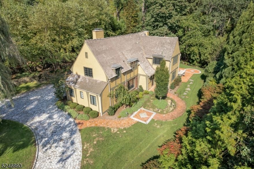 Move right in to this GORGEOUS 5 Bedroom, 6 Full Bath Tudor located in the heart of Short Hills. Nestled among pretty gardens in one of the most prestigious neighborhoods Short Hills has to offer. Beautiful renovations, elegant craftsmanship and a fabulous floorplan for everyday living and entertaining. Truly the best of both worlds with a classic, vintage home with all the updates you'd want. Renovated Kitchen with granite, stainless appliances and Pantry opening to spectacular Family Room with fireplace and built-ins.Elegant Living Room with fireplace. Graceful Dining Room.  To Die For SunRoom with vaulted ceiling. Spectacular custom Mud Room.  1st level Guest Suite. 1st Level Exercise Room with cool vaulted ceiling. Butler's Pantry. Lovely Primary Suite with spectacular spa-like Bath and steam room. 2 other bedrooms on 2nd level are ensuite and there is a fabulous custom Office. The Brick Patio, dazzles surrounded by a lush lawn and glorious landscaping. Charming cobblestone circular driveway. An impressive old Short Hills home close to top notch schools, New York City, Midtown Direct Train and downtown Millburn shopping and restaurants.