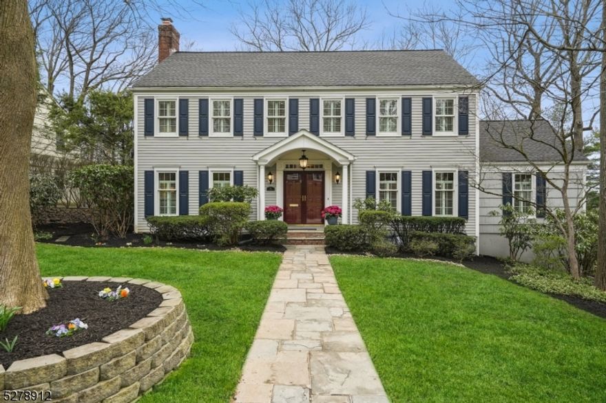 Welcome to this beautiful 4 bedroom, 3.1 bath colonial nestled on a 0.34-acre lot. Step inside to discover the inviting living room with a wood-burning fireplace and French doors leading to a serene bluestone patio. Entertain with ease in the dining room, seamlessly flowing into a gourmet eat-in kitchen featuring top-of-the-line Thermador professional appliances, including a 6-burner stovetop, vented hood, refrigerator, and dishwasher. Experience the convenience of both a butler's pantry and a dedicated beverage station, complete with a built-in wine refrigerator and water filtration system. Upstairs, retreat to four bedrooms and two full baths, including a spacious primary suite with a walk-in closet and luxurious bathroom with a charming clawfoot tub and separate stall shower. The lower level offers a versatile recreation room, direct access to a convenient 2-car garage, a full bath, and the potential to craft a fifth bedroom. Situated in the highly desirable town of Summit, NJ, enjoy the best of both worlds with the tranquility of the nearby Watchung Reservation and access to the bustling downtown. Minutes to the Summit train station with direct trains to NYC and Hoboken. Zoned for the highly sought-after Franklin Elementary School.