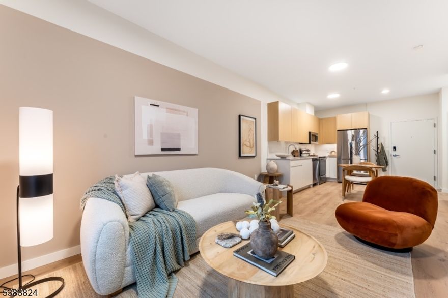 This brand new 116 unit residential community is equipped with in-home washers and dryers, stainless steel appliances, and soft-close, hardware-free cabinets, elevating both aesthetics and functionality. Oversized windows flood each space with natural light, creating a bright, inviting atmosphere. Select units feature private terraces, offering refreshing outdoor space and a new perspective on leisure. More than just a home, Hue Soul is a retreat from the ordinary, designed to nurture both well-being and connection. Stay active in the state-of-the-art gym, find relaxation in the wet and dry saunas, rejuvenate in the cold plunge, or practice peace and intention in the dedicated yoga room. Need a quiet place to focus? The modern co-working space provides an inspiring environment for productivity.  At Hue Soul, community comes to life-where neighbors become friends. Whether unwinding or entertaining, the rooftop deck sets the scene with an outdoor kitchen, fire pit, and patio seating. Inside, the lobby lounge offers a welcoming space for socializing, while the movie room provides the perfect spot to kick back and enjoy a film. For those who value sustainability, eco-conscious residents will appreciate the convenience of electric car chargers. Every amenity is designed to support a lifestyle that feels as good as it looks. Experience life in full brilliance at Hue Soul schedule a tour today and discover the difference in every detail.