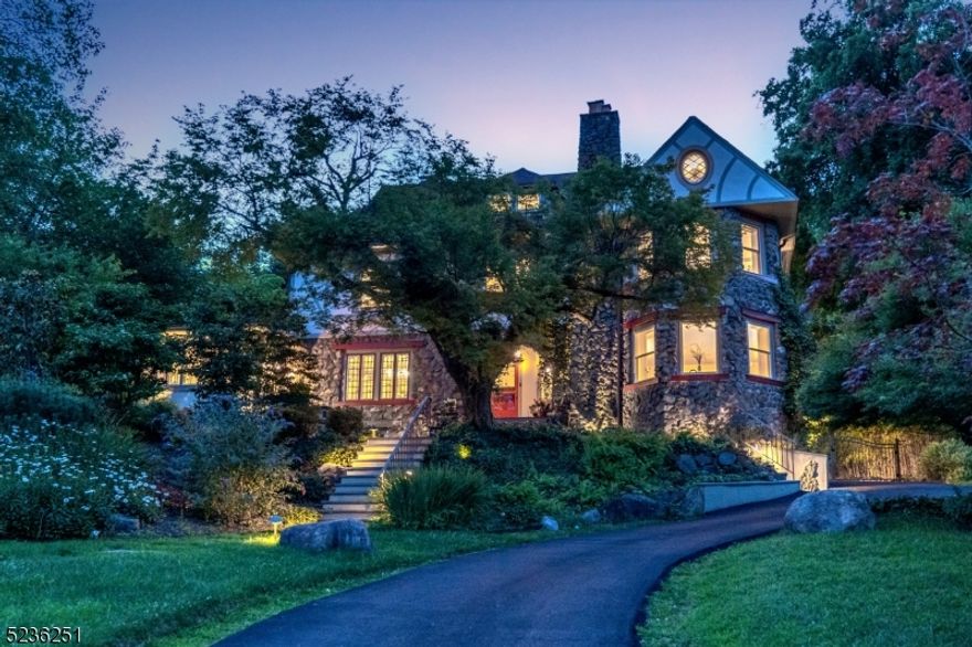 Step into history with this charming urban oasis, built-in 1897, featuring a unique blend of uncoursed local fieldstone and stucco. Meticulously restored over 20 years, it harmoniously combines timeless charm with modern upgrades. Historic detail abounds with detailed moldings, a triple stained glass window, stone walls, exposed brick walls, gleaming floors 5 fireplaces and a Family Room with NYC skyline views. Upgraded kitchen, spa like baths, updated HVAC, updated windows, and electric, provide ultimate comfort. NYC Midtown Direct train 2 blocks away. No car needed! A highlight is the chef's dream kitchen with Subzero fridge, Jennaire wall ovens, range, and wine fridge. Enjoy year-round views of the Manhattan skyline, daily sunrises, and sunsets, offering a serene escape from the city bustle. The gardens, designed by Richard Hartlage, boast unique plantings respecting the environment.  A private oasis awaits, surrounded by lush "Yellow Bamboo." Indulge in the saltwater pool with waterfalls, set in stone walls, twinkling with evening lights. A fire pit area and cherry trees on the third level provide tranquility. For city dwellers, this haven offers the best of both worlds - a historic retreat amidst suburban life. Fully sprinklered and thoughtfully lit, the gardens' beauty is showcased. Embrace the enchanting gardens featured in prestigious tours, and make this sanctuary yours. Imagine all of this only 5-7 minutes from NYC train + Upper Montclair village. NO CAR NEEDED.