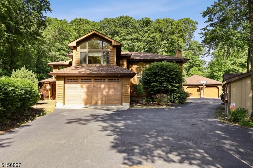 A beautiful oasis in Jefferson Township.  Check out this custom home with 4 generously sized bedrooms, 3 baths, and plenty of living space to spread out.  The granite eat-in kitchen with island is adorned with its own gas fireplace and 3 season room with separate heat.  This is the house that will grow with you.   A stunning backyard with heated pool, lovely landscaping, and extra space to roam.  Oversized two-car detached garage for all your toys.  Privacy, seclusion, and natural beauty at your fingertips.