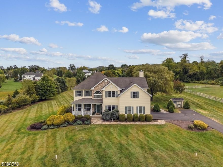 Drive up through open green pasture to the rocking chair covered front porch that greets you into this spacious and younger center hall colonial! Two story foyer, formal living and dining rooms with hardwood flooring, double door entry to first floor home office, large powder room and spacious center island eat-in kitchen with pantry and stainless steel appliances is open to family room with wood burning fireplace, recessed lighting and 2nd staircase to upper level. Upstairs offers primary suite with sitting room area and huge walk-in closet, full bath with water closet, soaking tub, stall shower and double vanity. Three additional spacious bedrooms and updated guest bath complete the upper level. Basement has limitless possibilities with very high ceilings. Enjoy outdoor living with two-tiered paver patio with kitchen and grill, expansive room for games and entertaining. Other features include public water, storage shed (shed needs work/as-is), 5 year old gas water heater, thermal windows and more! Bathroom materials will be left for primary bath renovation. Underground invisible dog fence and collar included.