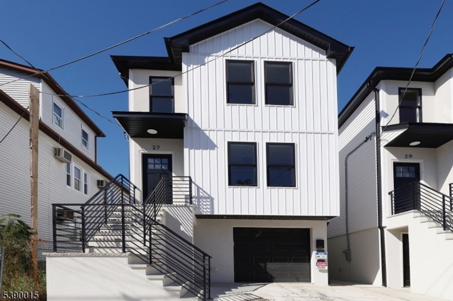 JUST UNPACK IN THIS BRAND- NEW 2 FAMILY HOME IN DESIRABLE SOUTH PATERSON SECTION WITH LOW TAXES OF APPROX $3,200, 5 YEAR TAX ABATEMENT . EACH UNIT OFFERING BRIGHT AND OPEN LIVING ROOM LEADING TOO MODERN KITCHEN WITH BREAKFAST COUNTER AND DINING AREA.  2 SPACIOUS BEDROOMS AND 1 FULL BATH AND LARGE PRIMARY BEDROOM WITH ITS OWN FULL BATH AND PRIVATE ENTRANCE. WASHER AND DRYER IN UNIT FOR EASY CONVENIENCE! LOWER LEVEL OFFERING LARGE REC ROOM, AND 1 CAR ATTACHED GARAGE WITH EXTERIOR ACCESS TO BACKYARD GREAT FOR A LITTLE SPACE FOR RELAXING. CONVENIENTLY LOCATED TO MAJOR HIGHWAYS AND TRANSPORTATION, GREAT FOR COMMUTERS - JUST MINUTES AWAY FROM NYC! ENJOY NEAR BY SHOPPING, AND RESTAURANTS ALL WITHIN WALKING DISTANCE.