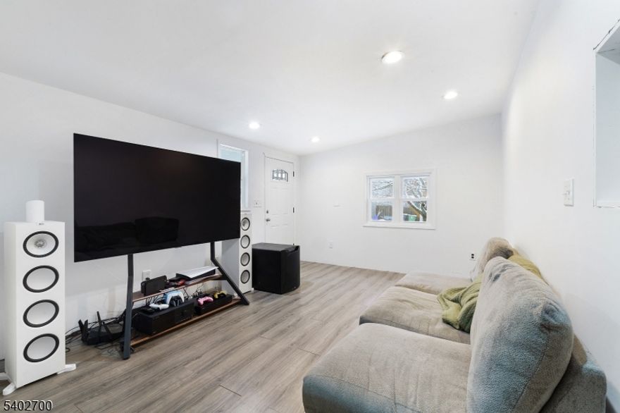 Move right in and add your personal touches to this well-maintained home with recent updates, offering nicely sized rooms and hardwood floors throughout, along with new windows, siding, and doors. The inviting living room provides the perfect space to relax or gather with friends, while the garage adds everyday convenience and extra storage. Step outside to enjoy a fenced yard ideal for entertaining, pets, or play, and unwind on the covered porch with your morning coffee or evening drink. This 3-bedroom, 1-bath home is tucked away on a quiet dead-end street, offering a peaceful setting with the added bonus of a nature preserve and scenic hiking trails just steps away at the end of the road perfect for outdoor enthusiasts and those seeking privacy without sacrificing convenience.