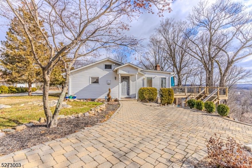 Impeccable Ranch Rental w/stunning Lake & NYC Skyline Views surrounded by Jonathan's Woods which includes 635 protected green acres & hiking trails. Truly an oasis of peace & privacy located in the Cedar Lake section of Denville - truly unique & captivating property. OVER 1 acre on quiet, dead end street. ONE FLOOR LIVING. Features include updated galley style kitchen with stainless steel appliances. NEW dishwasher & refrigerator. Separate dining area. Bright living room on the back of home. An abundance of windows throughout provide a beautiful ambience, tons of natural light & stunning views. Charming stone fireplace. 2 generous sized bedrooms. 1 Full and half bath. Clean and nicely updated baths.. The back deck is a priceless addition to this home, offers easy indoor/outdoor access & a quiet lifestyle. Perfect for entertaining or relaxation! TONS of Storage in unfinished bsmt. Off street parking. Enjoy the lovely and desirable Cedar Lake community- Clubhouse, beaches and boating! Tons of activities for all ages. Minutes to DWTN Denville -a vibrant DWTN with shopping, restaurants & events. Experience tranquility & privacy right in your own backyard w/all the conveniences of NYC mass transit & easy access to major hwys. Tons of upgrades include new window units, washer/dryer, water softener ('21), well pump ('22), water heater, neutralizer system, water softener ('23) and BRAND NEW windows will be installed in LR & Kitchen March 2024.