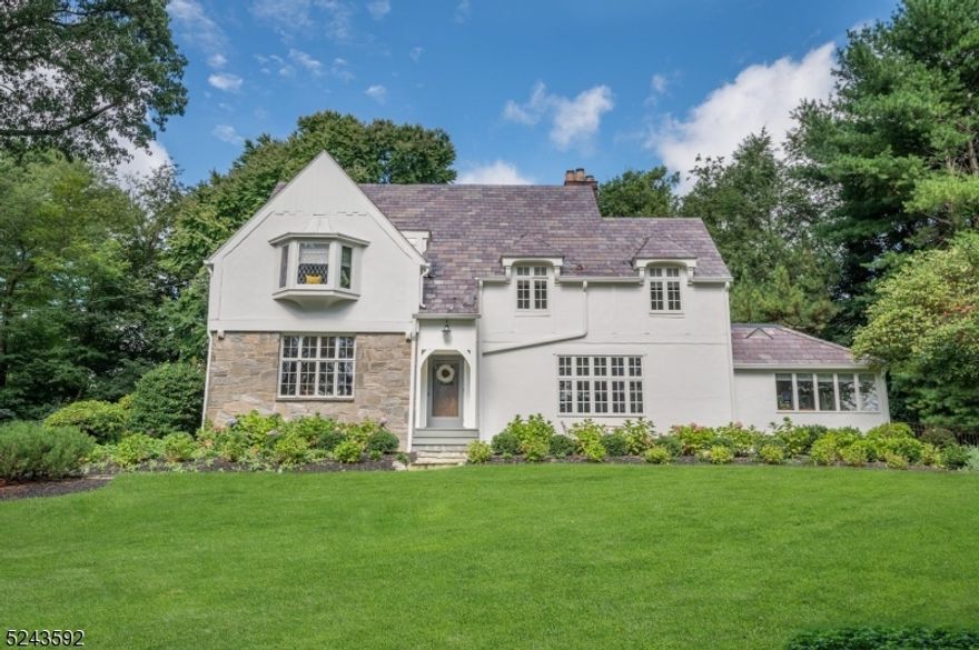 Picturesque 4 bedroom 6 bath Northside tudor with exceptional private fenced in yard with pool. Situated on over a half acre of land, this sophisticated charmer is not to be missed. Renovated kitchen with white cabinitry and stainless steel appliances, adjacent family room with gas fireplace.  Formal living room with gas fireplace and dining room, sun filled office and leisure room fill the first floor. Second floor boasts 4 bedrooms and baths. Finished lower level  with recreation room, laundry and full bath complete this true gem.  Welcome home!!