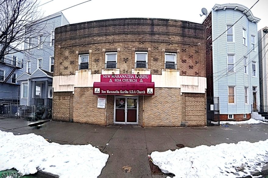 Opportunity meets vision with this rare double-lot commercial property totaling 5,000 square feet, ideally located in the sought-after Journal Square area on the border of the West Side. Currently operating as a place of worship, the property offers a solid structure with flexible interior space, making it ideal for redevelopment or adaptive reuse. Whether you're an investor or developer, this is a prime opportunity to renovate, repurpose, or pursue new construction. The generous lot size and footprint open the door to a compelling redevelopment concept. Envision a newly constructed four-story residential building designed with modern layouts, efficient living spaces, and strong long-term income potential. The vision includes a beautifully designed rooftop lounge deck for residents to relax, entertain, and take in stunning skyline views creating an elevated living experience that adds both lifestyle appeal and value.  The existing use provides interim functionality while plans and approvals are secured. Conveniently located just up the street from NJ-440 and one block from JFK Boulevard, the property offers excellent access to public transportation, making commuting into NYC seamless. Surrounded by shopping, dining, and the vibrant culture of Jersey City, this location continues to see strong growth and demand. Bring your vision and strategy this is a unique opportunity to create something truly special.