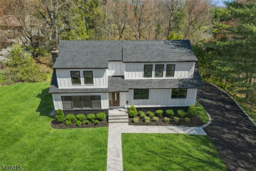 Welcome to this private, fully renovated residence on a dead-end street where modern luxury meets thoughtful design. Every inch of this 6-bedroom, 4.5-bath modified split-level has been meticulously transformed to be as functional as it is beautiful. The expansive living room flows seamlessly into the formal dining area, creating an ideal space for both everyday living and elegant entertaining. The recently updated kitchen features sleek stainless steel appliances, modern finishes, and ample space for the home chef. Whether hosting dinner parties or weeknight meals, this open, inviting layout delivers. Three generously sized bedrooms provide comfortable retreats. The standout is the bedroom with its own ensuite bath offering privacy and convenience. A full bath serves the two additional bedrooms, each offering abundant closet space and natural light. Escape to the expansive primary suite a true retreat featuring not one, but two walk-in closets plus additional closet space to accommodate even the most extensive wardrobe. The luxurious ensuite bath provides spa-like comfort, while the dedicated sitting area is large enough for a full couch and television, creating the perfect space to unwind, read, or enjoy your morning coffee in complete privacy. The ground-level floor offers a versatile den/FR perfect as a home office or casual gathering space complemented by a convenient half bath. This level offers endless possibilities for how you live and work.