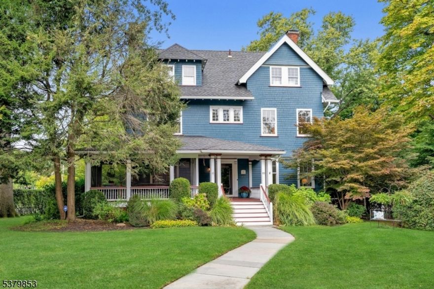 Prepare to be captivated by 89 Porter Place where classic elegance, modern updates, and an exceptional setting come together in one of Montclair's most beloved neighborhoods. Set on a beautifully landscaped lot with mature plantings that bloom year-round, this 6-bedroom, 3.5-bath Colonial is a rare blend of beauty, privacy, and effortless living. Sunlight floods the home, beginning in the gracious foyer with its striking open staircase that connects all three levels. The main floor flows seamlessly, featuring gleaming hardwood floors and spacious living, dining, and family rooms perfect for entertaining or relaxing. The renovated kitchen impresses with custom Parsons cabinetry, granite countertops, built-in bench seating area, and a center island. French doors off the dining room open to the most enchanting screened-in front porch, while a wisteria-draped pergola shades the rear deck both enhanced with Sonos speakers, along with the kitchen.  Upstairs, the second level offers a primary suite with full bath, two generous bedrooms, another full bath, and flexible walk-in closet with laundry. The third floor features three more bedrooms with soaring ceilings, an additional full bath and plenty of storage ideal for guests, work, or creative space. Extras include, central air, main level powder room, exterior-access elevator, finished lower level and a two-car garage. Just minutes from the vibrant downtown Montclair, 89 Porter Place is gracious, inviting, and truly one of a kind.