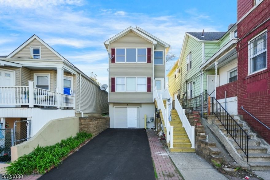 Welcome to 50 Albion Ave, a well-maintained and highly versatile two-family property in the sought-after Totowa section of Paterson. Designed for both strong rental performance and comfortable living, each unit features 2 bedrooms and 1 full bath, along with a modern open-concept layout that seamlessly connects the living, dining, and kitchen areas. Central air and a private driveway add even more comfort and convenience. The second-floor unit has been fully renovated with a brand new kitchen, updated bathroom, and new appliances delivering a clean, turnkey finish that today's tenants and buyers demand. The above-ground finished basement features an additional 3 bedrooms and a full bath, creating flexible living space ideal for extended occupancy, guest quarters, or additional recreational space. Strategically located near major highways, shopping, and everyday conveniences, this property checks all the boxes for investors and owner-occupants alike: updated interiors, functional layout, and strong upside. A rare, move-in-ready multi-family with built-in income and versatility.