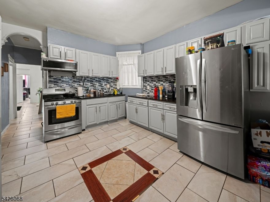 Well-maintained 3-family property offering strong income potential in a convenient Paterson location. Each unit features 4 bedrooms and 1 full bath, providing spacious layouts ideal for a variety of living arrangements. All units are currently occupied, generating consistent rental income. The property includes separate living spaces with baseboard gas heating, window unit cooling, and a full walk-out basement offering additional utility and storage. Situated on a regular 25x100 lot, the home is constructed with vinyl siding and is connected to municipal water and sewer. Conveniently located near parks, schools, shopping, and public transportation, making it attractive for both tenants and investors. A solid opportunity to own a multi-family property with existing cash flow and long-term upside.