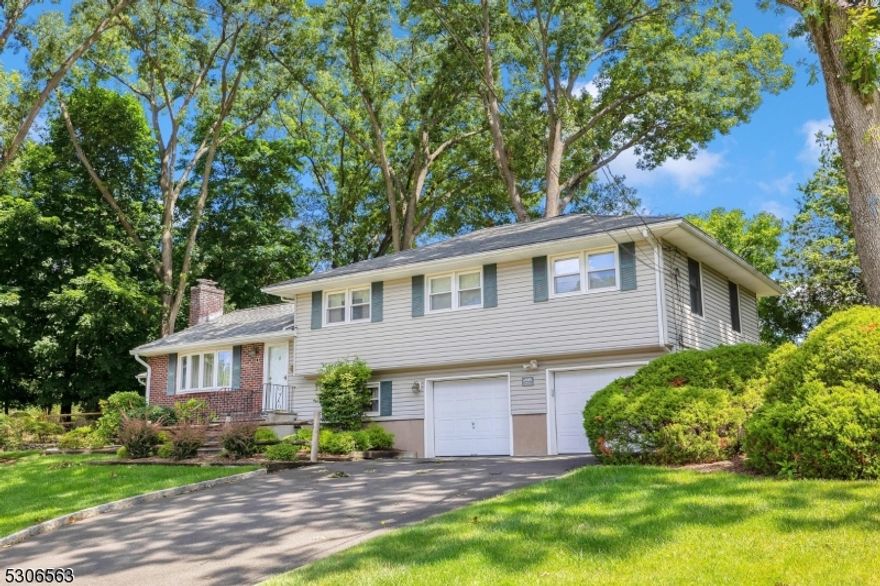 This exceptional split-level home, coming to market for the first time in 45 years, is a true gem in the heart of Bergen County. Located in a sought-after cul-de-sac, this residence seamlessly blends space, style, and a prime location. Step inside a foyer that invites you into a large living room exuding old-world charm, perfect for both relaxation and entertaining. The formal dining room is ideal for hosting memorable gatherings, while the expansive eat-in kitchen with direct access to a ground-level deck, is just what those cooking enthusiast need. Enjoy your morning coffee or unwind in the sunroom, which offers tranquil views of the lush backyard. The second floor boasts five generously sized bedrooms, including a primary suite with a private powder room, along with a full bath off the hallway. The ground level features a versatile den with access to a two-car garage, a full bathroom, and outside access that extends your living space outdoors. The basement adds even more value with a cozy rec room, laundry facilities, and a utility room. Situated close to major highways, with train services just a town away, this home offers everything you need for comfortable and convenient living. Don't miss the chance to own this beautifully maintained home in one of Bergen County's most coveted neighborhoods a perfect blend of charm, space, and location waiting for you to make it your own!