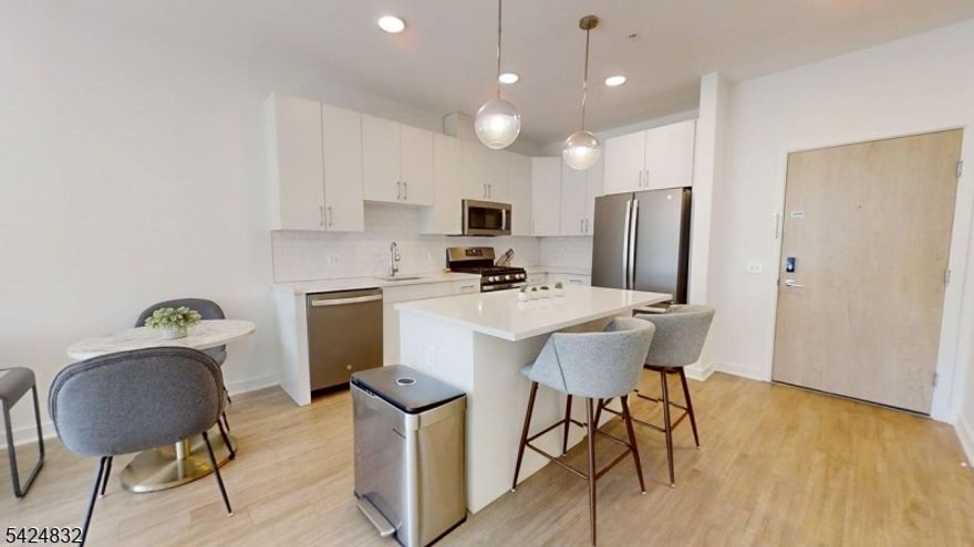 Luxury 1-bedroom, 1-bath apartment offering approximately 658 sq ft of modern living. Features include quartz countertops, SS appliances, an island kitchen, Frig w/ Ice Maker, in-unit W/D, & high-speed internet. Building amenities include a resident lounge w/ coffee & media area, an outdoor balcony lounge, & a rooftop lounge w/ beautiful views that can also be used as a private event space (w/ BBQ).  Ideally located just a block to NJ Transit train & bus service to NYC perfect for commuters. Bike Storage Closet Avail - Outside Parking $50 - Wheelchair Accessible (Rooms)  High Speed Internet Included
