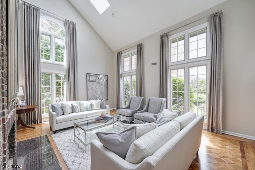 Experience the upscale lifestyle and understated elegance of this sun-filled Colonial located on a sought after cul-de-sac in the prestigious Hill section of Madison.  This stunning home is perfectly renovated and beautifully designed and offers everything that home buyers want today including architectural interest, a wonderful open floor plan, spectacular chef's kitchen, lovely master suite with spa like bath, finished lower level, 3 car garage and more.  The living room is spectacular with cathedral ceilings, two skylights and gas fireplace. The white kitchen is perfectly planned and boasts top of the line appliances, breakfast bar, 2 pantries, plenty of cabinets and counter space and a wet bar with beverage center and dishwasher.  This amazing kitchen opens to the breakfast room and family room with gas fireplace.  A first floor bedroom, full bath and laundry room complete this first level. The second level has 4 bedrooms and two full baths and the large master bedroom suite is sure to please with 2 walk-in closets, dressing room and new master bath with steam shower, free standing tub, 2 sinks and cathedral ceilings.  The lower level has a recreation room, game room, powder room, mudroom and storage.  Great for entertaining inside and outside this home boasts a large TimberTech deck, and a beautifully landscaped yard that is perfect for play, relaxing and gardening. You are sure to enjoy enjoy all Madison has to offer voted the #1 town to living in by NJ Monthly.