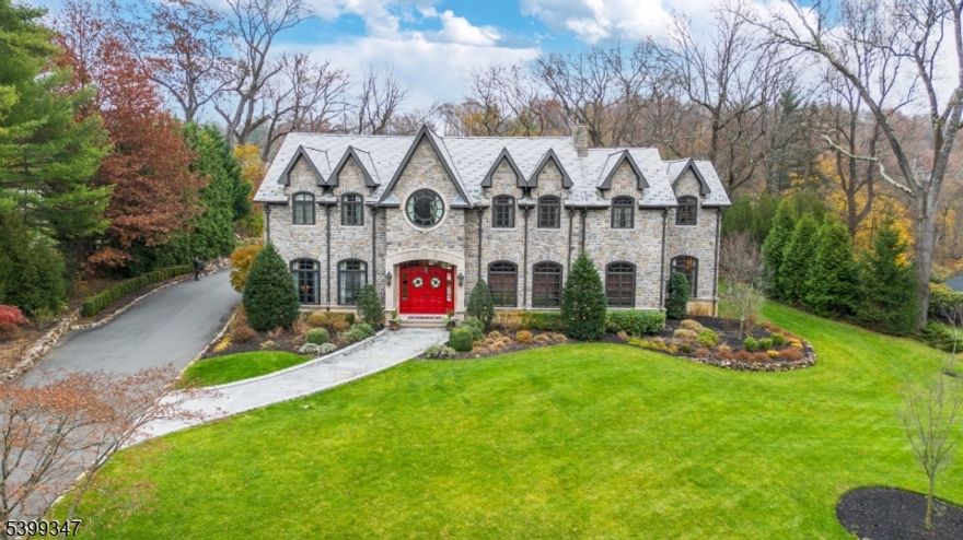 Welcome to pure perfection in the prestigious town of Essex Fells. Drive through private gates and up an impressive winding driveway to this breathtaking residence set on an expansive wooded lot w/ sweeping mountain views. Step inside to a remarkable foyer w/ a grand wrap-around staircase. To the left, a sophisticated living room awaits and to the right, a richly appointed office. The state-of-the art kitchen flows seamlessly into the dining room-with top-of-the-line appliances, custom carpentry, and fireplace. A 1st floor laundry room, easy backyard access, and stairs leading to both the 2nd floor and basement complete the main level. Throughout the home, every bathroom has been designed w/ great detail and luxury in mind. Upstairs, you'll find 3 spacious bedrooms, each w/ its own full en-suite bath and walk-in closet w/ custom shelving. 1 bedroom includes doors leading to a private balcony. An additional laundry room is provided on this floor for easy functionality. The primary suite is a retreat in itself, featuring a private balcony, a large walk-in closet fit for royalty, and a spa-like primary bath complete w/ soaking tub, dual vanities, bidet and a shower, crafted to deliver true resort-style indulgence. The fully finished basement redefines luxury w/ a complete family room, home gym, pool and poker rooms, full bar, and wine cellar. Step outside to an outdoor oasis. Stroll through a charming trellis walkway leading to a 3-car garage, a fully equipped kitchen, brick