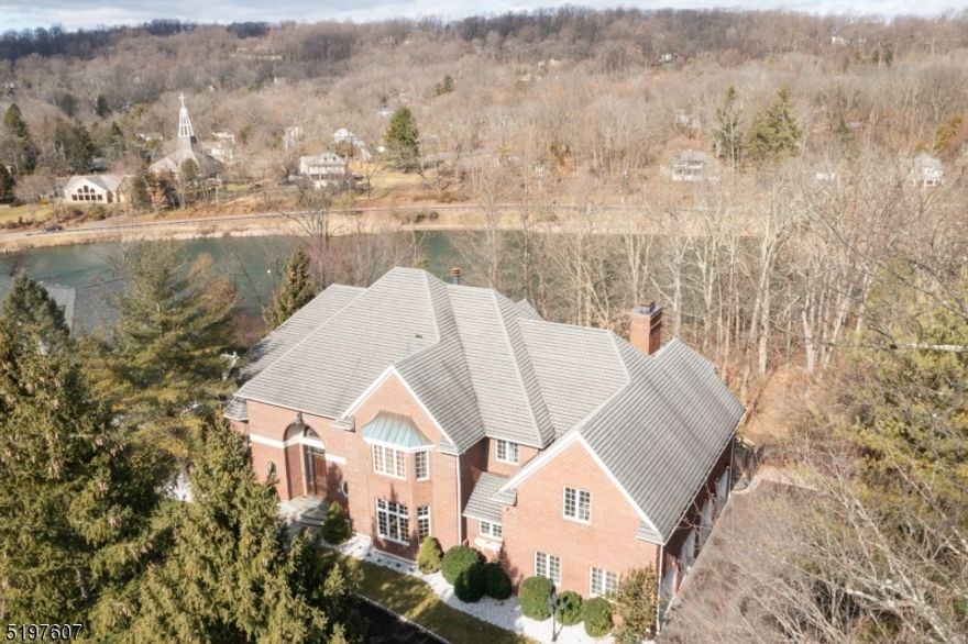 Rare Opportunity to live on the prestigious street of Gallowae in Watchung, offering Lake views through all the seasons. Bordering Best Lake, this grand custom full brick exterior home welcomes you with a circular driveway, and features a private lush 1 acre fenced in lot with 6,272 square feet of living space plus a sprawling finished lower level and a 4 car garage. Exceptional features of the home are: 5 Bedroom suites on the second level all with en-suite bathrooms, a grand two story foyer with curved staircase, hardwood floors, 5 fireplaces, high ceilings, elegant living room, kitchen & family room all appointed with wall to wall window lake views, a private library with built-in cabinetry and office, two powder rooms on main floor, grand dining room, spacious chef kitchen with premium appliances, two islands, a separate dining area, walk in pantry and 2 butler pantries, and open to the family room. The lower level offers abundant entertainment for your guests with multiple walk outs to the expansive paver patio for outdoor grilling, an oversized game room with wet bar, media room with stone fireplace, wine room, gym, a craft room which could be a potential 6th Bedroom, and plenty of storage with a walk up to the garage. A commuters Dream location with Just Minutes from RT 78 to NYC, Top Rated Schools including Pingry School, and Shopping.