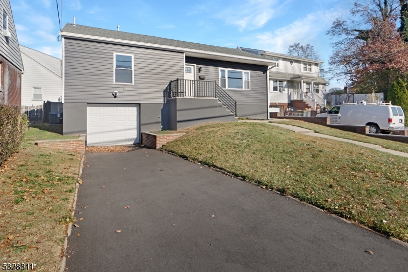 Welcome to this beautifully updated three-bedroom, two-bath raised ranch with an attached one-car garage. The home features a spacious living room, open-concept kitchen with custom cabinetry, quartz countertops, and stainless steel appliances, plus a convenient laundry room. The first floor has three generously sized bedrooms and a full bathroom, with a large basement offering potential for recreational space. Step outside to a patio perfect for outdoor enjoyment. Conveniently located one block from Belleville High School, with easy access to public transportation and major highways. Tenants are responsible for all utilities, lawn care maintenance, and snow removal. Landlord covers taxes. Don't miss this opportunity!