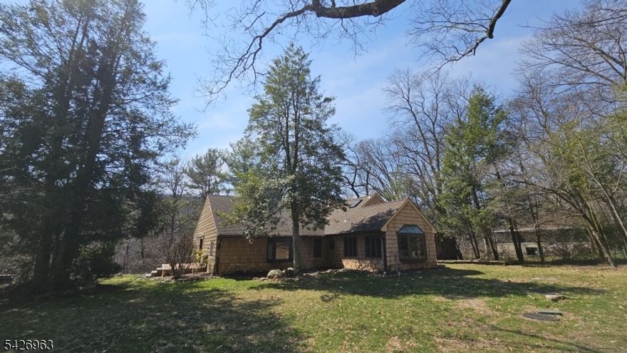 DISCOVER YOUR OWN PRIVATE OASIS! SET ON NEARLY 2 ACRES OF LUSH, WOODED LAND, THIS UNIQUE 4-BEDROOM, 2-BATHROOM CUSTOM EXPANDED RANCH OFFERS A PERFECT BLEND OF SECLUSION AND MODERN COMFORT. OFFERING VERSATILE LIVING SPACE, THE HOME FEATURES A THOUGHTFUL LAYOUT DESIGNED FOR BOTH QUIET RELAXATION AND ENTERTAINING. INSIDE, YOU'LL FIND A MIX OF CLASSIC HARDWOODS AND FUNCTIONAL FINISHES, INCLUDING A WELL-EQUIPPED KITCHEN THAT FLOWS SEAMLESSLY INTO BRIGHT, AIRY LIVING AREAS. UNWIND IN THE DEDICATED HOT TUB ROOM A TRUE INDOOR RETREAT DESIGNED FOR YEAR-ROUND RECREATION AND RECOVERY. THE EXPANSIVE PRIMARY SUITE AND GENEROUS ROOMS PROVIDE AN ATMOSPHERE FOR EVERYONE.STEP OUTSIDE TO A SPRAWLING LOT THAT SERVES AS A STUNNING NATURAL BACKDROP FOR EVERY SEASON, COMPLETE WITH BREATHTAKING SCENIC VIEWS. WITH AN OVERSIZED PARKING AREA FOR UP TO 10 VEHICLES, THERE IS PLENTY OF ROOM FOR GUESTS OR OUTDOOR GEAR. EXPERIENCE THE PEACE OF WEST MILFORD WHILE STAYING JUST MINUTES FROM LOCAL AMENITIES.