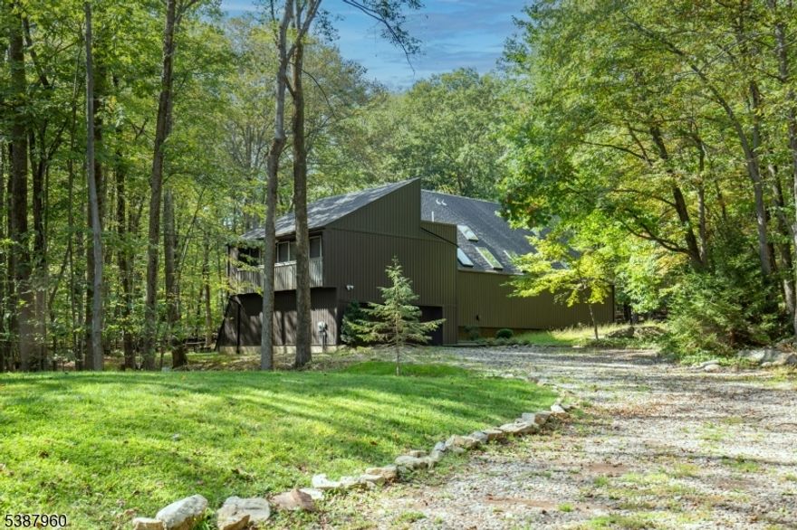 This recently renovated contemporary architectural gem, with  an open & flowing floorplan wonderfully blends in with over two acres of wooded privacy. You'll be immersed in country living and solitude. Designed by an architect for his personal residence, the home's harmony with nature is immediately apparent. The low maintenance wooded landscaping is reminiscent of New England with stones and native plants. Daily living and entertainment coexist with long runs of expansive windows and a huge private and open deck that takes in the great outdoors.  Wonderful natural wood interior, oak floors and beamed ceilings. An open and accessorized chef's kitchen, with a massive center island and a suspended fireplace that is reminiscent of crisp fall and winter gatherings. Sunlight enters from all directions including multiple skylights and floor to ceiling windows. Top rated schools and so convenient to outdoor recreation that includes Christie Hoffman Park, Ken Lockwood Gorge, the Columbia Trail and a network of wonderful cycling roads and trails. Close proximity to NYC rail, bus, major highways and shopping in many of the quaint areas surrounding this sought after Tewksbury location.