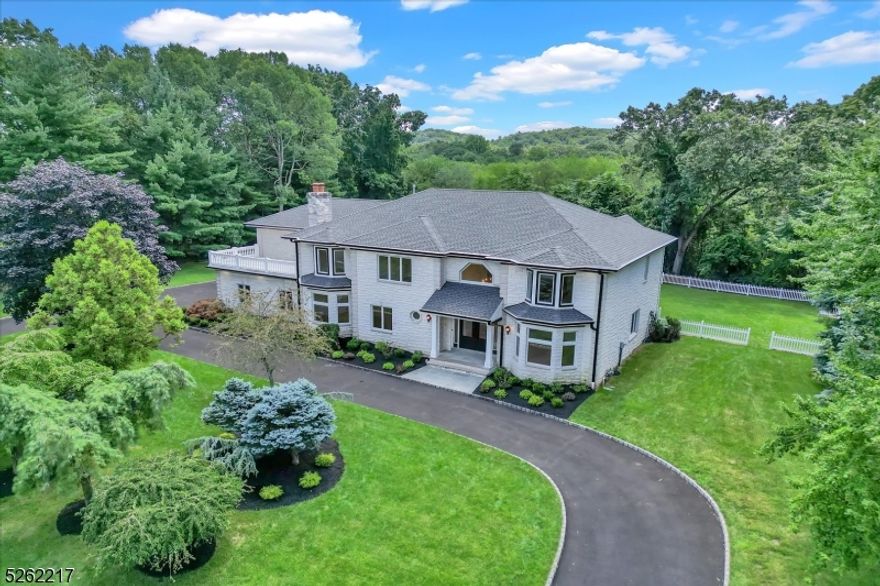 A breathtaking house on a one of kind private 2.8 acres property at the end of a cul-de-sac. A gorgeous two-story foyer welcomes you into this stunning colonial. This house features a great open floor plan with countless upgrades. Custom kitchen w/quartz countertops and high-end appliances, custom millwork throughout, custom glass wine room, and much more. First floor features a formal living and dining room, as well as a large living room with the kitchen being the center of the house. Laundry, mud area and a 3-car garage finishes the first floor. Upstairs you find a beautifully finished master suite, with large walk in closed, and large master bath featuring heated floors. 3 additional bedrooms and a junior suite complete the upstairs. Full basement and a backyard of complete privacy and trees as far as the eyes can see. A must see! LA related to seller.