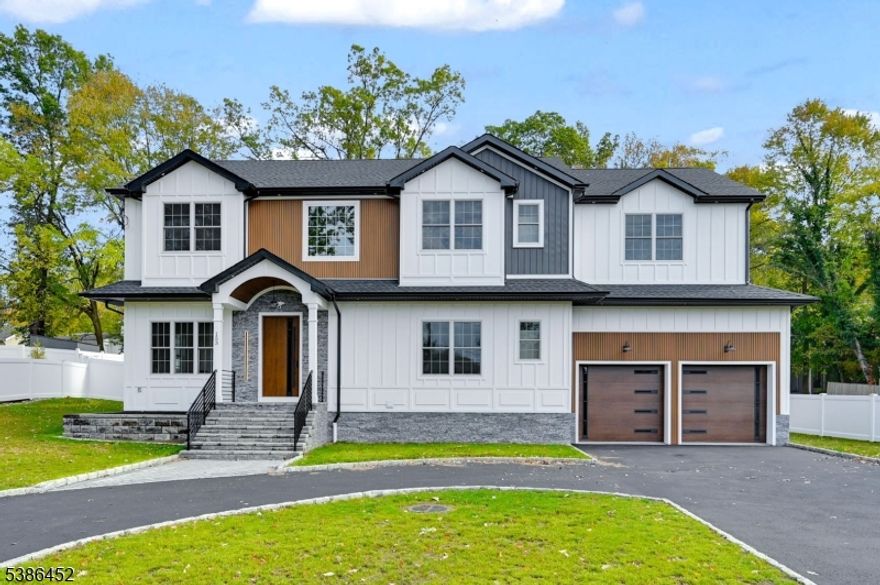 Welcome to the stunning newly constructed home with 6 bedrooms, 5.1 baths, approx 4,500 sq. ft. on a flat Fenced 0.38-acre lot and huge Circular Driveway. From the moment you arrive, the grand 2-story foyer & flowing open floor plan invite you in. Rich hardwood floors, elegant accent walls, & custom trim/millwork infuse each space with timeless character. The formal dining rooms set the stage for refined gatherings, while the heart of the home the gourmet kitchen is equipped with high-end stainless appliances, quartz countertops, a center island, and ceiling-height Shaker cabinetry. The family room, anchored by a fireplace, feat. 3 sets of glass doors, opening to a dramatic covered patio w/ its own outdoor fireplace perfect for seamless indoor-outdoor entertaining. A 1st-floor guest suite w/ full bath, mudroom, & powder room round out the main level. Upstairs, the primary suite is a private retreat with cove ceiling, expansive WIC, & a spa-like bath complete w/ soaking tub, frameless stall shower, dual vanities & private balcony. Four additional bedrooms (one en-suite), hallway bath, & a convenient laundry room complete the second floor. Descend to the fully finished walk-up basement to discover a dedicated recreation space w/ built-in bar and kitchenette, a flex/office room, a full bath, a utility room outfitted with a custom vanity and a storage room. Located in highly sought-after Livingston, close to top schools, downtown, NYC train access. 10-Yr Remodel Warranty
