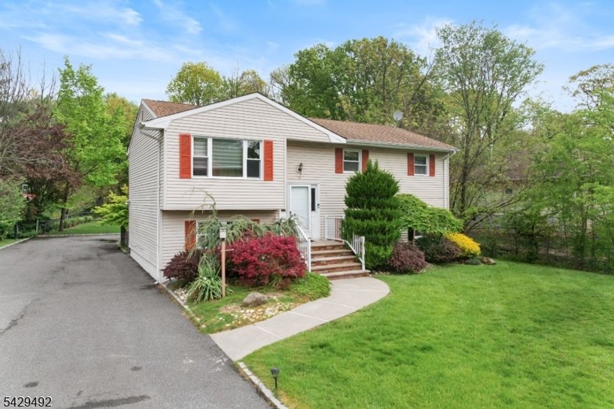 Welcome to 13 Fishel Road, a spacious and inviting home nestled in one of Edison's most sought-after neighborhoods. Perfectly suited for a family, this property offers an abundance of living space both inside and out. The home features a versatile layout with a walkout lower level, providing additional living or entertainment space with easy access to the outdoors. An oversized garage offers ample room for parking, storage, or a workshop setup. Step outside to a generously sized backyard ideal for gatherings, play, or simply relaxing in your own private retreat. Whether hosting summer barbecues or enjoying quiet evenings, this outdoor space delivers endless possibilities.  Located within a highly regarded school district, this home combines comfort, convenience, and community appeal. With its desirable location and room to grow, 13 Fishel Road is a fantastic opportunity to put down roots in North Edison.