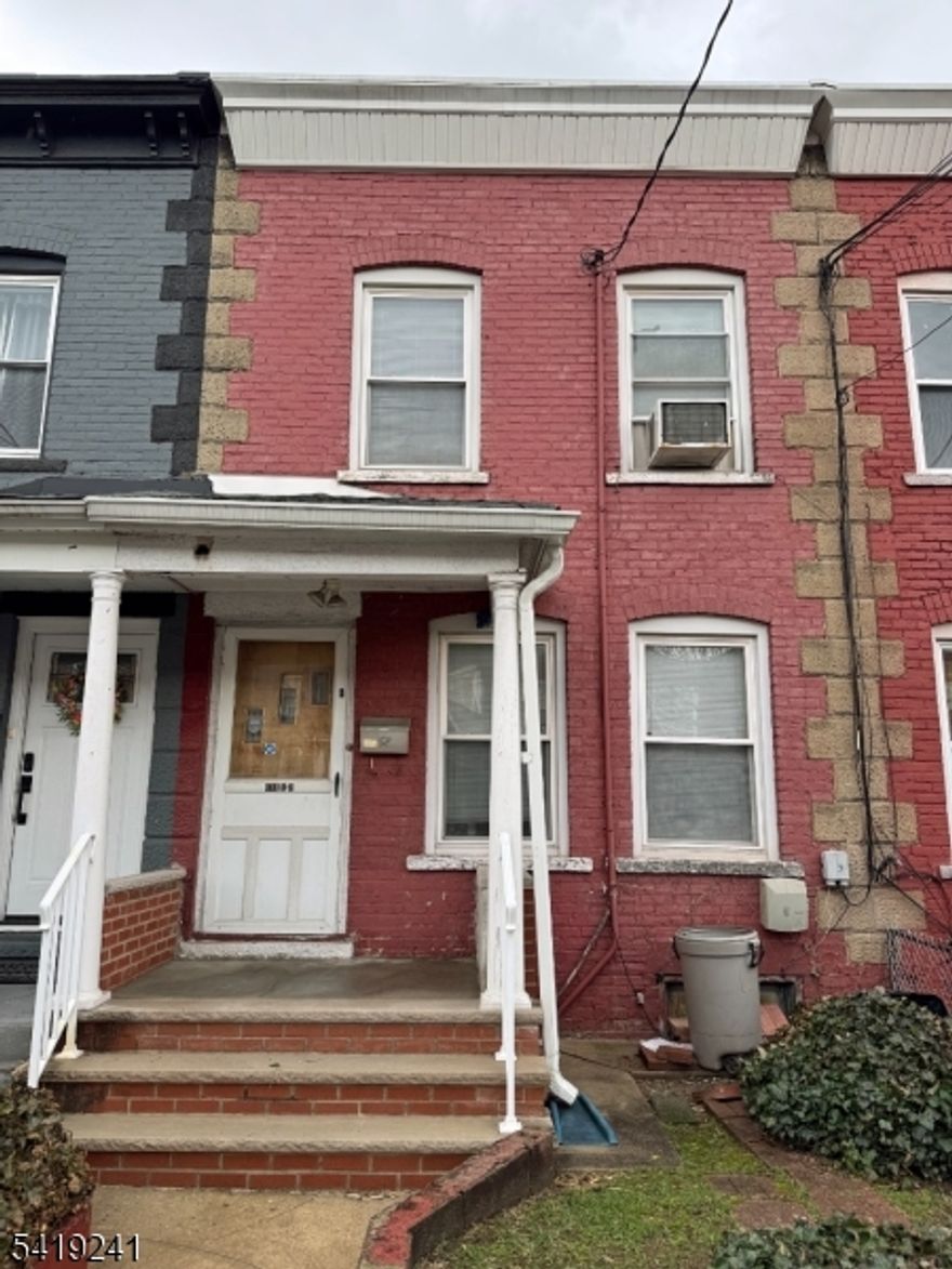 Great opportunity to own this 3-bedroom, 1-bath attached rowhouse single-family in a prime residential location. Enjoy the benefits of low taxes and no HOA fees. This home needs updating and repairs, but it's perfect for an investor or a buyer looking to add value. The interior rooms are larger than you may think. The main floor features a living room, dining room, and eat-in kitchen with direct access to a private backyard. The second floor offers three bedrooms and a full bathroom. The full basement features good ceiling height and can be finished to provide a home office or recreational space. Centrally located and only blocks to public transportation, parks, shopping, and dining, with easy access to NYC, the PATH, and major highways. The property may not qualify for traditional FHA, VA, or other Conventional financing. Buyers should explore an FHA 203(k) loan, a Conv loan, or similar renovation loans. Being sold AS-IS strictly.