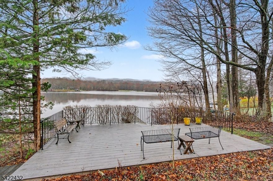 Lakefront Ranch! Located on the peaceful shores of Crandon Lakes, this home provides an unparalleled opportunity to embrace the tranquility of this sought after lake community. Rustic charm and comfort of year round living. Easy one level living with open floor plan, and nicely sized rooms create space to entertain. The wood stove insert Fireplace serves as a cozy gathering spot for all along with forced hot air system as well as Central Air Conditioning that keeps you comfortable in all seasons. Open Kitchen with plenty of cabinets and prep space that is open to Dining Room and Living Room with Lake views throughout.  Step out to the finished porch that features electric baseboard heat, updated windows and take in the breathtaking views of the Lake. Entertain lakeside on the Deck near the water and keep your boat on the 20 ft dock.  2 Bedrooms and a additional 3rd/office allow plenty of space for all.  (Note: 2 bedroom septic). Crandon Lakes has so many amenities with multiple Beaches and Playgrounds and located close to shopping, restaurants and access to State Parks and Trails including the Appalachian Trail. Crandon Lakes also offers 2 beaches, ball-field, playground, use of covered pavilion and boating(Electric Motors), canoeing, kayaking, stand-up paddle boarding and fishing.  Come see what all the Lake Front fuss is about for yourself!