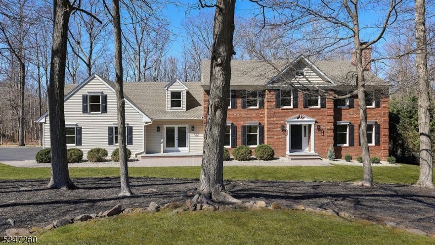 Classic center hall Colonial home offers 5 bedrooms, 4.5 bathrooms, 3 fireplaces, and timeless charm with elegantly appointed wood trim and refined design elements throughout. A bright and airy floor plan highlight an impressive and warm curved staircase that welcomes guests to the foyer. The heart of the home is an open kitchen that overlooks the private wooded back yard, and features a large prep island, and eat in kitchen area with sliding doors that lead to the outdoor deck. A 1st floor office is an ideal work from home space and boasts French exterior doors and built in bookcases. A rare bonus room above the garage offers a full kitchen, full bathroom and an abundance of natural light. The oversized family room boats a wet bar, wood burning fireplace, and direct access to a four season room with vaulted ceilings and skylights where one can enjoy the picturesque property all year long. A walk through butler's station adjacent to the dining room provide ease during entertaining. The primary bedroom is highlighted by 2 separate entrances, an expansive sitting area, fireplace, vaulted ceilings, 2 closets, and a grand en suite bathroom with dual vanities, large stand up shower and tub that overlooks the tranquil backyard. Dual staircases lead to an unfinished lower level that offers plenty of space for recreation and hobbies. Located in an excellent school district, and within close proximity to highways 78/287/202/206/22.