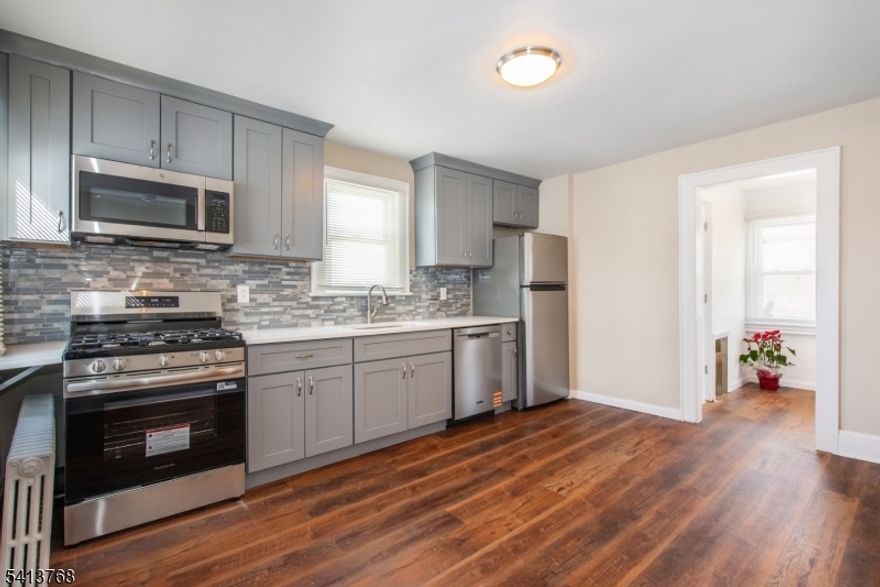 Fantastic renovated spacious 2nd floor apartment in a great neighborhood! This property features laminate floors throughout, front and back entrances, a brand-new eat-in kitchen with 42 inch cabinets, quartz counters, & stainless steel appliances, a large bedroom and bonus bedroom/office, and a mudroom/sunroom with deck off the back. Owner pays water, sewer and snow removal.