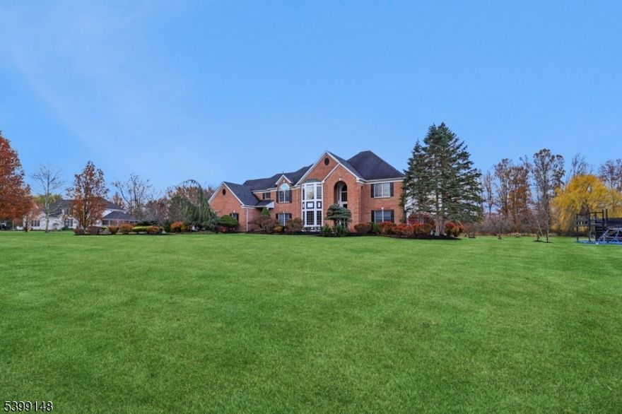 Experience timeless elegance and modern luxury in this stunning 5,300 sq. ft. center hall colonial, ideally nestled at the end of a cul-de-sac in one of Readington's most desirable neighborhoods. Sitting on just over 2.4 acres this six-bedroom, five-and-a-half-bath residence embodies refined living at its best. From the moment you enter, you're greeted by grand, light-filled spaces and exquisite custom carpentry details throughout. The fully renovated interior seamlessly blends sophisticated design with everyday functionality, featuring a chef-inspired eat-in kitchen with premium stainless-steel appliances, quartz counters, and a large center island perfect for entertaining. A spacious family room with a fireplace, elegant formal living and dining rooms, and a private study make the main level ideal for both relaxation and productivity. Upstairs, the primary suite is a true retreat complete with a spa-like bath, walk-in closets, and serene views of the property. Five additional bedrooms offer comfort and versatility for guests. Lower level provides a blank canvas ready to be customized. Step outside to the deck off the kitchen, overlooking a newly designed garden and a custom-built playground. Readington, renowned for its top-rated schools, scenic beauty. Readington's charming small-town character, vibrant community life, and proximity to local farms, vineyards, and parks make it one of Hunterdon County's most sought-after places to live.