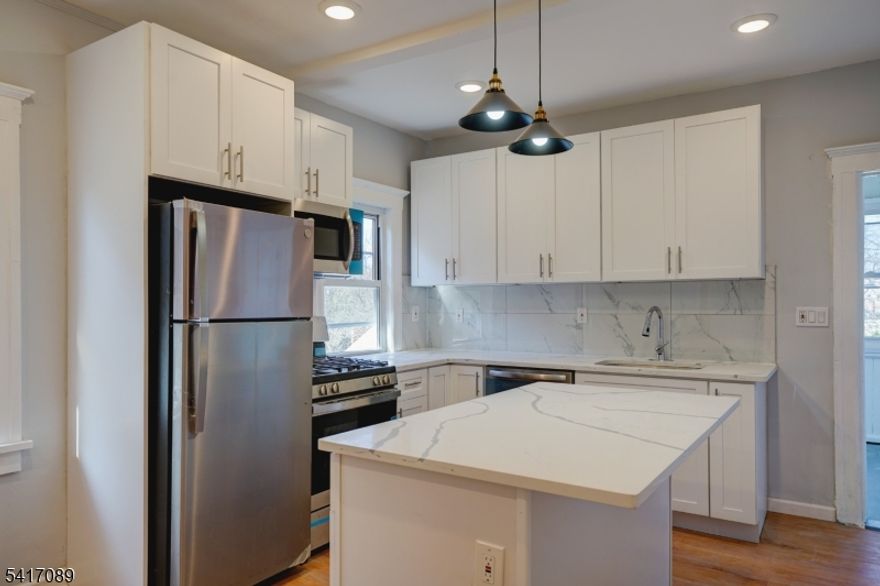 Best Location! Spacious superbly located, two-story townhouse-style duplex at the heart of Summit. 5 minutes walking distance to downtown Summit train station to NYC, restaurants, shops etc. Step into the generously sized kitchen, equipped with brand-new stainless steel appliances, refrigerator, gas stove, microwave with vent, dishwasher, and a captivating center island, an ideal setting for gatherings. The property features four bedrooms, an office, and a relaxing sunroom with lovely views. There are three updated full bathrooms, along with new hardwood floors, sunlit rooms with large windows. Freshly painted throughout, and with central HVAC for year-round comfort, this residence underwent a comprehensive renovation in 2023. Enjoy all entertainment Summit has to offer.