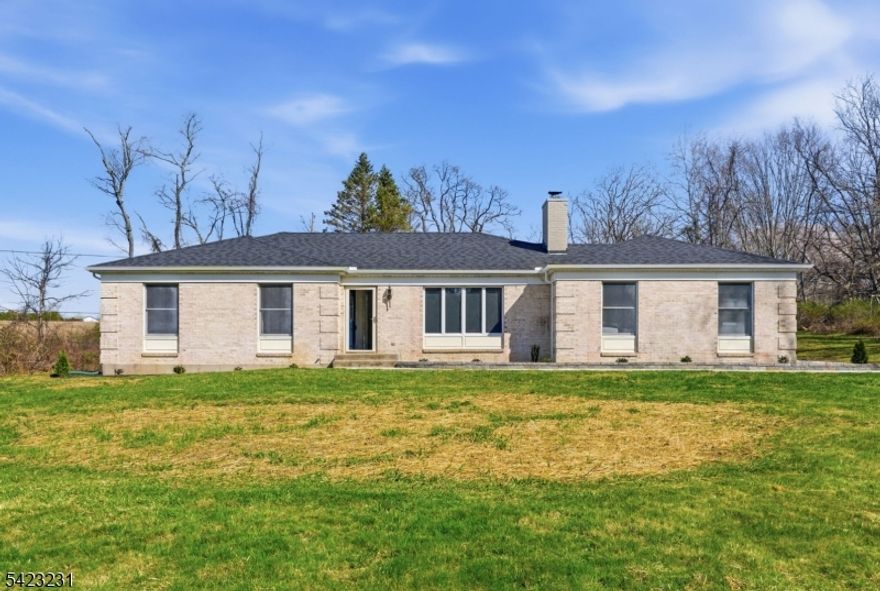 Welcome to this refreshed 3 bedroom, 2 bath Ranch on one of Washington Township's most sought after street. If you're looking for acreage and privacy this is the ONE for you! From the moment you pull into the driveway the street begins to disappear! Step inside to find a freshly painted interior and brand new laminate flooring, creating a clean and inviting feel throughout. This home features a spacious and functional layout, a primary bedroom with a private bath and walk-in closet, and a massive walkout basement. Major exterior improvements have already been taken care of, including  a brand new roof and gutters, a newly installed front walkway and refreshed landscaping that enhances curb appeal and creates a welcoming first impression. Enjoy the serenity of a private setting while still being conveniently located near commuter routes as well as shopping and restaurants. A must see!
