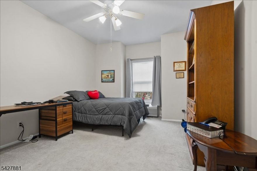 Welcome to this inviting Williamsburg model located in the sought-after Bald Eagle Commons, a vibrant 55+ community set among the picturesque hills of West Milford, NJ. Offering approximately 1,581 square feet of well-designed living space, this spacious unit features 2 generously sized bedrooms and 2 full bathrooms, providing both comfort and functionality for everyday living and hosting guests.Step inside to a bright and airy open-concept layout filled with natural light. The expansive living and dining areas create a seamless flow, ideal for relaxing or entertaining, while the kitchen offers ample cabinetry and counter space for easy meal preparation. The primary suite is a true retreat, complete with a walk-in closet and private en-suite bath. A second bedroom provides flexibility for guests, a home office, or additional living space.A rare and valuable feature of this unit is the prime parking spot conveniently located just steps from the front entrance, making daily living effortless. An assigned storage unit is also included, adding even more practicality.Enjoy the ease of low-maintenance living along with a wide range of community amenities, including a clubhouse, swimming pool, tennis courts, bocce ball, and scenic walking paths. Ideally located near shopping, dining, and recreational options, this home offers the perfect blend of comfort, convenience, and active adult living.