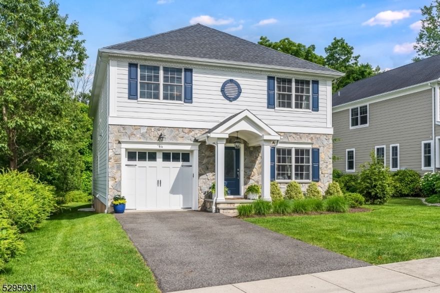 This exciting home has it all! Discover luxury living in this stunning Chatham Boro residence crafted by premier home builder Menza and Beissel. Exceptional quality abounds in the architectural details and custom finishes that define every space. The thoughtfully designed open-concept floorplan offers richly detailed rooms that feature high ceilings, hardwood floors, crown moldings, and tray ceilings. A striking main entry introduces you to light-filled living spaces, including a gourmet kitchen highlighted by a quartz-topped center island, custom cabinetry, and top-of-the-line appliances overlooking the dining room with its dramatic lacquered ceiling. The family room with cozy fireplace seamlessly connects to the composite deck, overlooking the private open lawn that backs up to wooded acres. Perfect for large gatherings or quiet evenings. Upstairs, the impressive primary suite awaits, with three outfitted closets and a sumptuous bathroom with soaking tub. Three additional bedrooms, two full baths, and a large laundry room complete this level. The lower level, finished in 2022, offers versatility for a fifth bedroom or office, full bath, and expansive space for recreation or relaxation. This coveted location is just steps from all that downtown Chatham has to offer including shopping, dining, parks, top-rated schools, and the NYC train. Its proximity to major highways is a bonus.