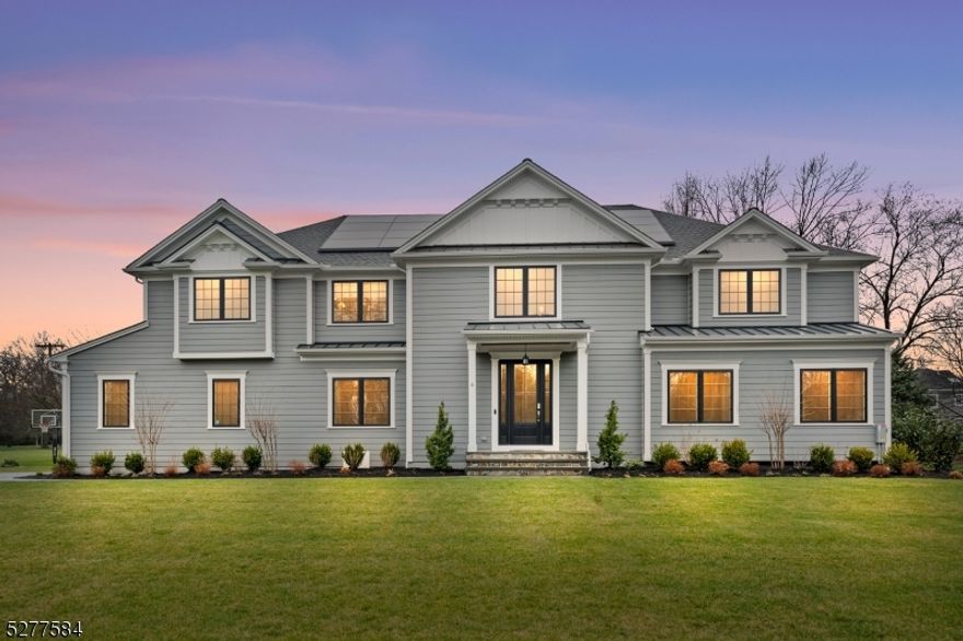 Nestled on a sprawling 1-acre lot, this modern masterpiece, built in 2023, offers an unparalleled living experience. Awash in natural light, this meticulously crafted home seamlessly blends luxury with functionality, creating an inviting sanctuary at every turn. For eco-conscious living, this home comes equipped with a state-of-the-art solar panel system and a built-in EV charger. Enter inside to discover a serene bedroom and full bathroom on the main floor, alongside a gourmet kitchen adorned with top-of-the-line Monogram appliances. Two living room spaces and a dining room complete the first floor. The second floor boasts four spacious bedrooms and a versatile bonus room. Custom-built California closets in all the bedrooms provide ample storage, while customized blinds offer privacy and ambiance throughout. Descending to the lower level, you'll find a finished daylight basement, offering an additional bedroom with a full bath and living space. Outside, enjoy the finished patio overlooking the flat backyard, ideal for outdoor entertaining or simply basking in the tranquility of the surroundings. The home is hooked to a full-house back-up generator for uninterrupted living and a full home water filter/softener, ensuring quality water throughout. Conveniently located in a desirable neighborhood, close to amenities and transportation, this home presents a rare opportunity to experience luxurious living at its finest.