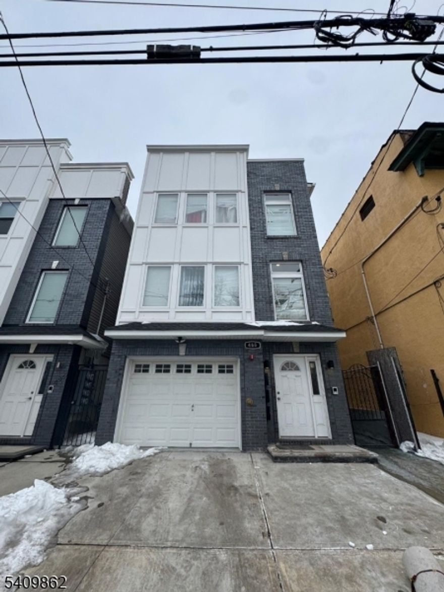 Newer "Three Family Home" Built in 2021 - Located near West Side Park, GS Parkway & University Heights - Featuring Brick Front, Hardwood Floors, Central Air, Granit Counters Tops, Stainless Steel Appliances, Low Taxes & much more