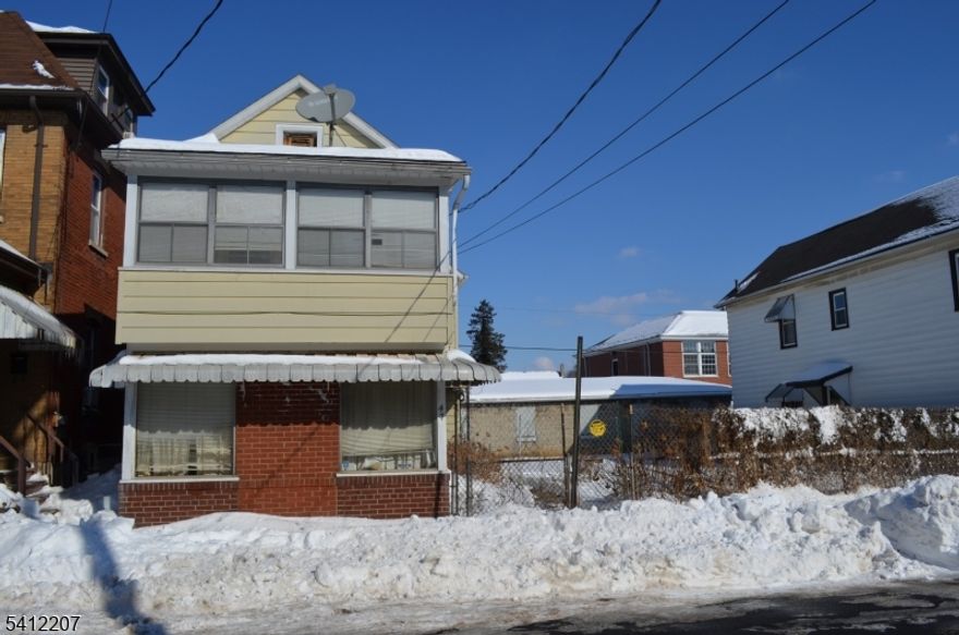 Fantastic opportunity for investors and/or owner-occupants! This two-unit multi-family home features ample storage and parking with four garage bays and two off-street parking spots. Tenants will appreciate the fenced side yard, perfect for privacy and outdoor enjoyment. Centrally located with quick access to major highways, commuter routes, and local amenities, this property promises strong rental appeal and long-term growth. A must-see for savvy buyers looking to expand their portfolio or generate rental income!