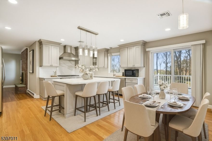 Welcome to this spacious and beautifully updated colonial set on a serene lot in Randolph's coveted Shongum Lake section. Thoughtfully modernized throughout, this home blends classic colonial charm with today's most desired upgrades. The heart of the home is the renovated chef's kitchen, featuring timeless cabinetry, stone countertops, stainless steel appliances, and an oversized island perfect for gathering and entertaining. The bright, open layout flows seamlessly into the dining and living spaces, offering both functionality and warmth. All bathrooms have been tastefully updated, combining clean, modern design with quality finishes. With five generous bedrooms, including a spacious primary suite, the home provides ample flexibility for guests or a home office. Enjoy the beauty of the outdoors from your expansive deck overlooking a private, wooded backyard ideal for relaxing, playtime, and hosting seasonal gatherings. Situated on a level half-acre lot, the property offers both privacy and room to grow. Located in the highly desirable Shongum Lake community, with easy access to schools and NYC transportation. On top of all this you are in some of the top rated schools in all of New Jersey.