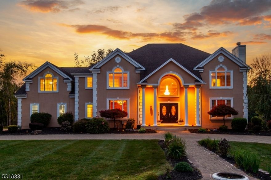 Breathtaking lakefront colonial offers walls of windows, high ceilings and tons of natural light. Situated in Mendham Lake Estates, this home majestically sits on a large level lot that is inclusive of the large open area on right. The inviting open floor plan, with 5 spacious bedrooms, 6.1 bathrooms, offers a fabulous main floor bedroom ensuite with its own sitting room and the most amazing views! Upon entry, you will fall in love with the two story foyer and bifurcated staircase leading to luxurious primary bedroom complete with two walk in closets, large bathroom, jacuzzi tub and shower. Additionally, the second level offers 3 remaining bedrooms and one of the two office options. The two story sunken living room is magnificent and offers stunning views, high ceilings, gas fireplace and sliders leading to a slice of paradise! The formal living room is spacious & offers a wood burning fireplace. The gourmet chef's kitchen is complete with large center island, granite counters, stainless appliances & more amazing views. This home boasts over 4800 square feet of living space, versatile floor plan, w full finished walkout basement & second office with full bath. Professionally landscaped property offers circular paver driveway, specimen landscape plantings & unobstructed lake views. 3c garage, brand new roof, public water. Come see what Randolph has to offer, sought after school district, beautiful trails, parks w excellent commuter location offering two train station options.