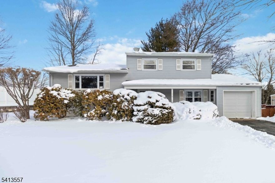 Welcome home to this beautifully maintained split-level home nestled in the heart of Succasunna. Offering 4 bedrooms and 1 1/2 baths, this lovingly cared-for home offers timeless appeal. Under the carpeting on the first and second levels, you'll find hardwood oak floors ready to be revealed. The formal living room features a vaulted ceiling and a large picture window that fills the space with natural light. A separate formal dining room also showcases a picture window. The eat-in kitchen offers plenty cabinet space, all in good condition, reflecting the pride of ownership throughout the home. Upstairs, the primary bedroom includes two spacious double closets, accompanied by two additional generously sized bedrooms with ample closet space. The main bath shines with a newer tub/shower update. On the ground level, you'll find a fourth bedroom, powder room, plus a spacious family room with sliding doors leading to the backyard and patio. The unfinished, dry basement includes laundry area, utilities, storage and an excellent potential for future finished living space. Additional highlights include newer vinyl windows thru-out, vinyl siding, 1 car garage, natural gas heat, public water and sewer, and a fenced backyard with patio ideal for outdoor enjoyment. Conveniently located near schools, parks, shopping, dining, and major highways, this move in ready home offers both comfort and accessibility. Don't miss the opportunity to make this well loved home your very own! Welcome Home!