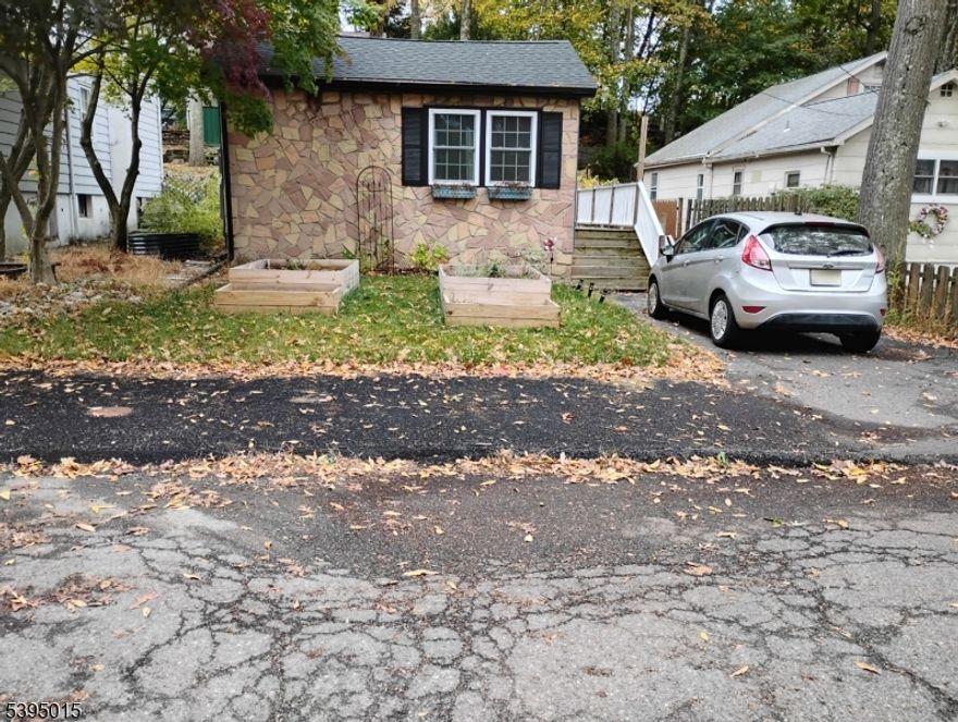 Charming ranch home on quiet street. Everything redone in 2022. New well pump, windows, doors, flooring, backsplash, mini-split heat system with central AC, cabinets, fixtures, roof, electrical panel, stove, dishwasher, washer/dryer hookup, hot water heater. City sewer. Not septic.