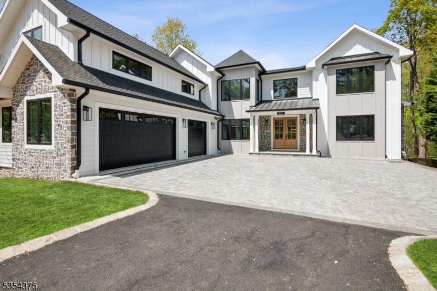 This Stunning New Construction boasts 5BR/4.1BA above grade plus a walkout basement with 1BR/1BA, wet bar, family room and gym. The kitchen has commercial Z-Line Stainless appliances that include a double oven with 6 burners and griddle, a pot-filler and commercial vent to the outside. Expansive quartz counters for multiple chefs and a prep island that seats 6-8.. The kitchen has an "eat-in" area with sliders to the Trek deck. Walk-in food pantry and wine bar. With flow to the oversize family room and fireplace, this is an entertainer's dream come true.  The formal DR and LR greet you from the vaulted foyer with a split staircase to the second floor. A guest room with private bath finishes the main floor. Main floor laundry room and mudroom off garage. The primary suite has two walk in closets (each 11'x12').  The primary bath features a soaking tub, dual vanity, shower stall, linen closet. Two bedrooms with a Jack n' Jill bath and a 4th bedroom with attached FB.  A 500 SF bonus room for play and TV are conveniently located next to the 2nd floor laundry.  The full basement has a gym, rec room, wet bar/kitchenette space with walk out to the paver patio.  The basement also has a BR/Full BA and additional storage rooms.  The outdoor patio can be used for BBQ.  The Trek Deck has a RainEscape draining system that keeps the patio dry.  The home is located 1.2 miles to NJ Train and close to I-78.