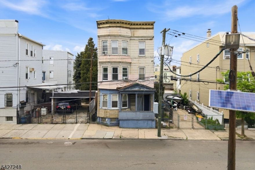 Rare opportunity in Newark's highly sought-after Ironbound section! This 3-family property offers exceptional flexibility and immediate potential, with the third floor, first floor, and basement to be delivered VACANT. Ideal for owner-occupants or investors looking to add value and create their own vision. Prime location near transportation, major highways, shopping, and dining. Don't miss this opportunity. Schedule your showing today!