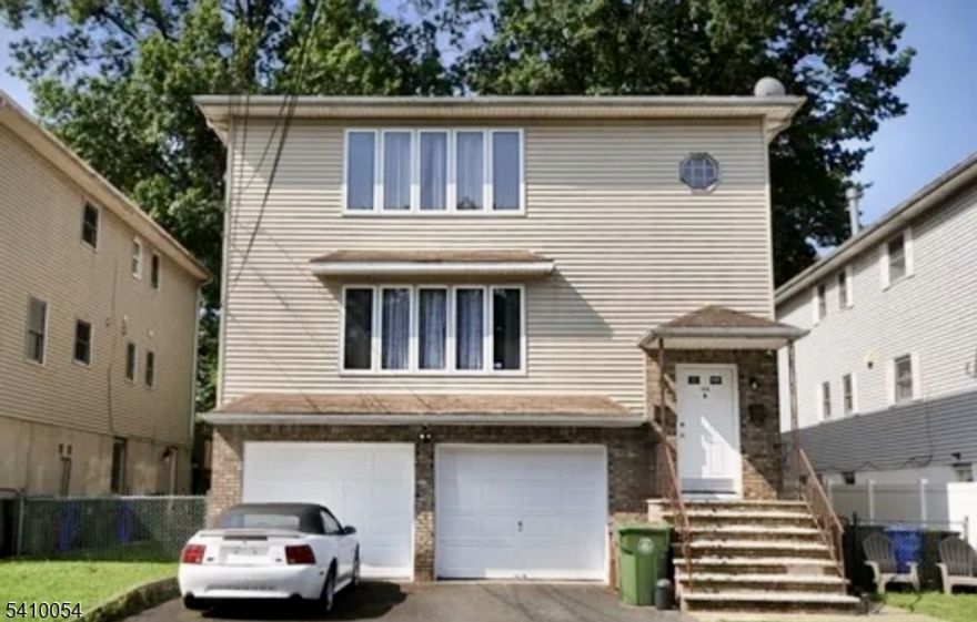 Fully renovated 1600sf top floor 3BR/2BA luxury residence featuring Central Air/Heat, open floor layout, and oversized rooms throughout. Bright and airy with abundant windows, beautiful hardwood floors, designer lighting, and spa-like bathrooms with touchscreen LED mirrors. Stunning eat-in kitchen with quartz countertops, ample cabinetry, under-cabinet lighting, and stainless steel appliances. Separate formal dining room, excellent storage, and brand-new dedicated washer/dryer. Garage parking for 1 car plus additional outdoor parking. Shared fenced backyard that backs to Wheeler Park is ideal for relaxing, entertaining, or enjoying time with pets. Just minutes from downtown Linden, restaurants, shops, and Linden Plaza. Commuters will appreciate walking distance to NJ Transit Station with direct line to NYC, plus easy access to major highways and Newark Airport. Pets are allowed with landlord's approval. Some photos have been virtually staged. Make your appointment, this residence won't last!