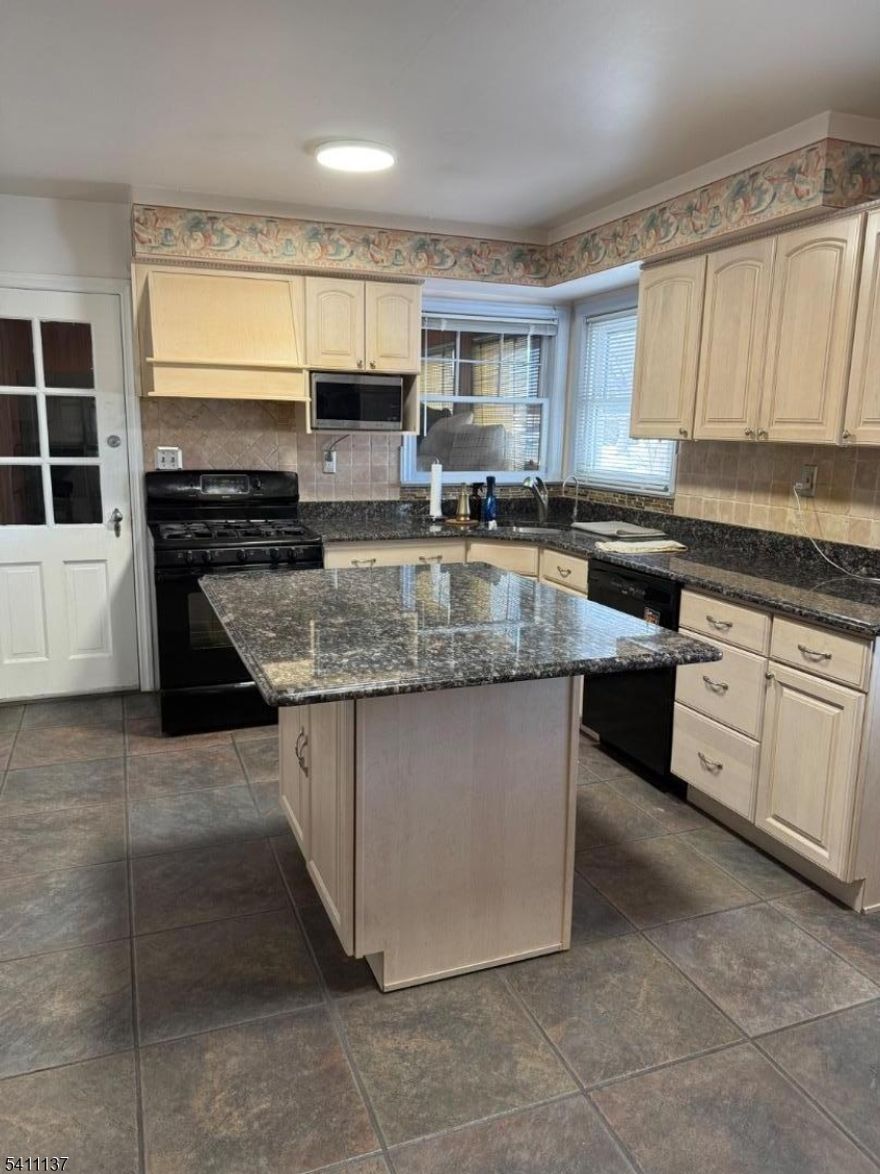 Step into this bright and welcoming 4 bedroom, 2 bath home that blends modern updates with comfortable everyday living. Natural light fills the main level, highlighting the fresh finishes and thoughtful upgrades throughout. The spacious layout includes generously sized bedrooms, the main has two his and hers walk in closets perfect for anyone who loves storage and organization. The updated kitchen and living areas create an easy flow for both relaxing and entertaining. A fully finished basement adds even more versatility, offering the ideal space for a family room, home office, gym, or play area. Additional storage areas ensure everything has its place. Convenience is built in with an in-home laundry area and an attached garage for parking. With its clean, modern feel and flexible layout, this home is ready for you to move in and make it your own.