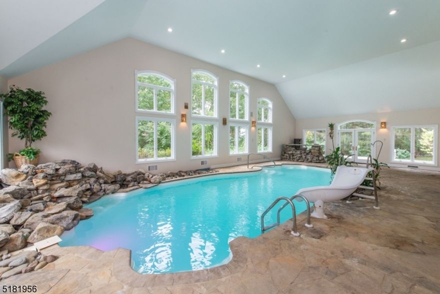 $30,000 incentive towards closing costs & can be used towards rate buy-down. Stunning one of a kind estate nestled on 1 acre only 1 hour from NYC offers 27+ private farm assessed acres, 6 acres is possible for future subdivision for additional home site! 5 BD, 5 Full Ba, 3 half ba.  The beautiful stone-paved circle driveway leads you to this stunning Colonial. Unfinished Guest house on right, 6 car garage in total & 1 car lift. The grand foyer has brilliant Italian marble flooring, 2 story ceiling & a gracefully curved staircase. The office & the formal LR open to the indoor heated pool, with cascading waterfall into the pool, which you can use year-round, has a half ba & surround sound system. The gourmet kitchen, conveniently located next to the DR, which offers top of the line Viking appliances, Brand New Bosch dishwasher, granite countertops, large center island, wine cabinet, & a spacious breakfast rm. The sun-filled great rm has 8 large windows & a floor to ceiling stone wood burning fireplace w/ french doors that open to the covered patio and backyard. On the 2nd level you find primary suite with 4 additional bdrms, a bonus rm, 4 full baths. The primary suite has a gas fireplace & stunning en suite with a jet tub, separate shower, dual vanity & complete with a bidet. The basement featuring a 15-seat home theater w/ large viewing screen & a power rm. There' also a bonus rm, gym area, storage, utility, 2nd full kitchen and full bath. Beauty, Nature and Relaxation Awaits!